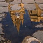 The cathedral and bell tower in the puddle