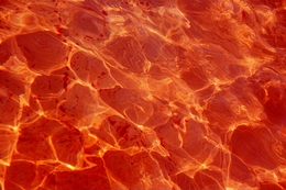 Fire reflected in water. 