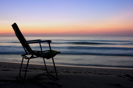 A chair facing the sea 