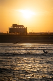 Orange sky and last wave at dusk 